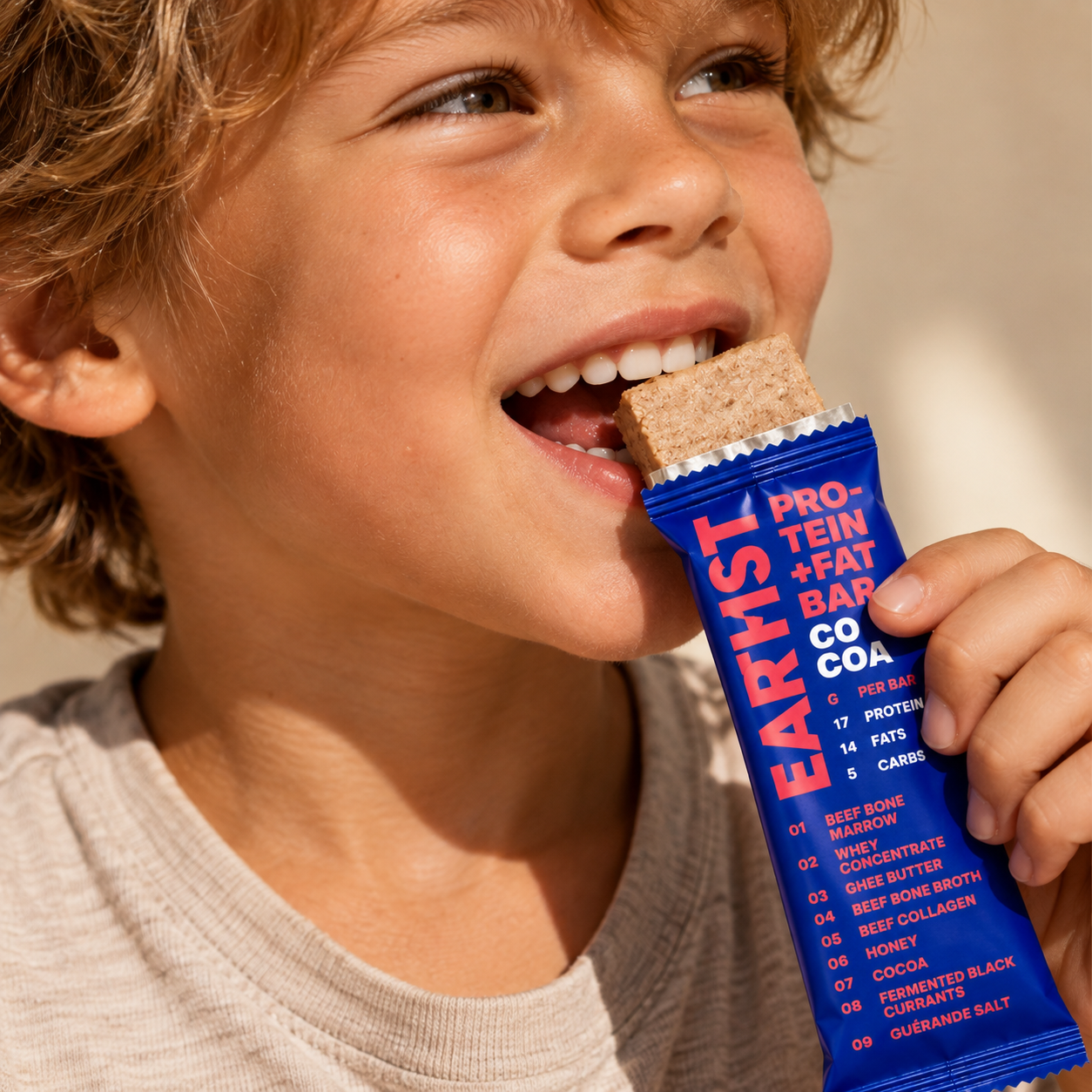 A child enjoying an EARTHIST Cocoa bar